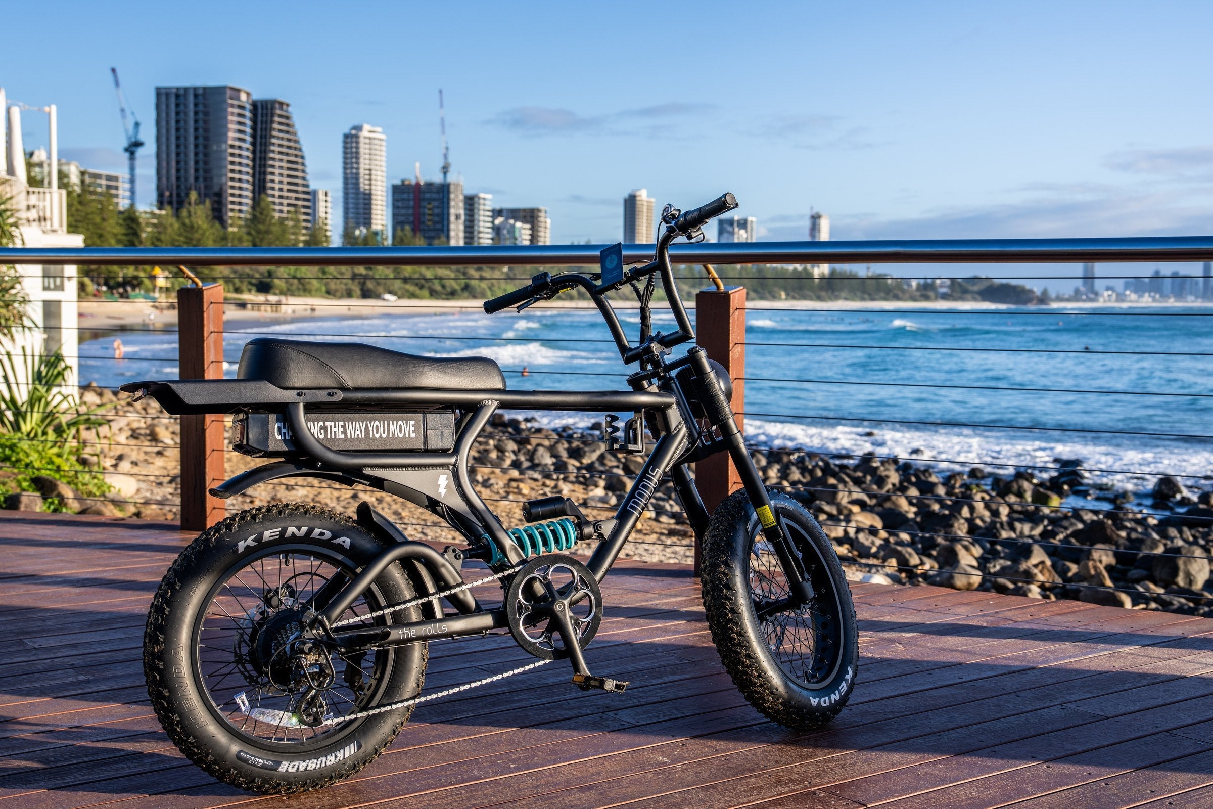 The Rolls side profile on the Burleigh boardwalk showing the moto bench, fat tyres and teal coil shock